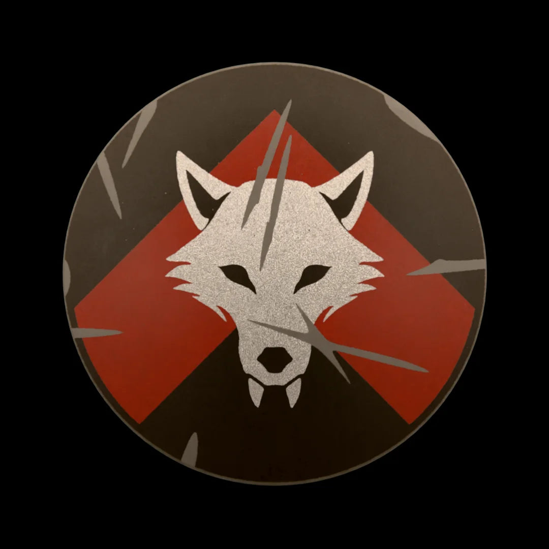 Castle Clad Bricks Dark Bluish Grey round shield with Metallic Silver wolf head on Dark Red chevron on black backing. Heavy damage edition.
