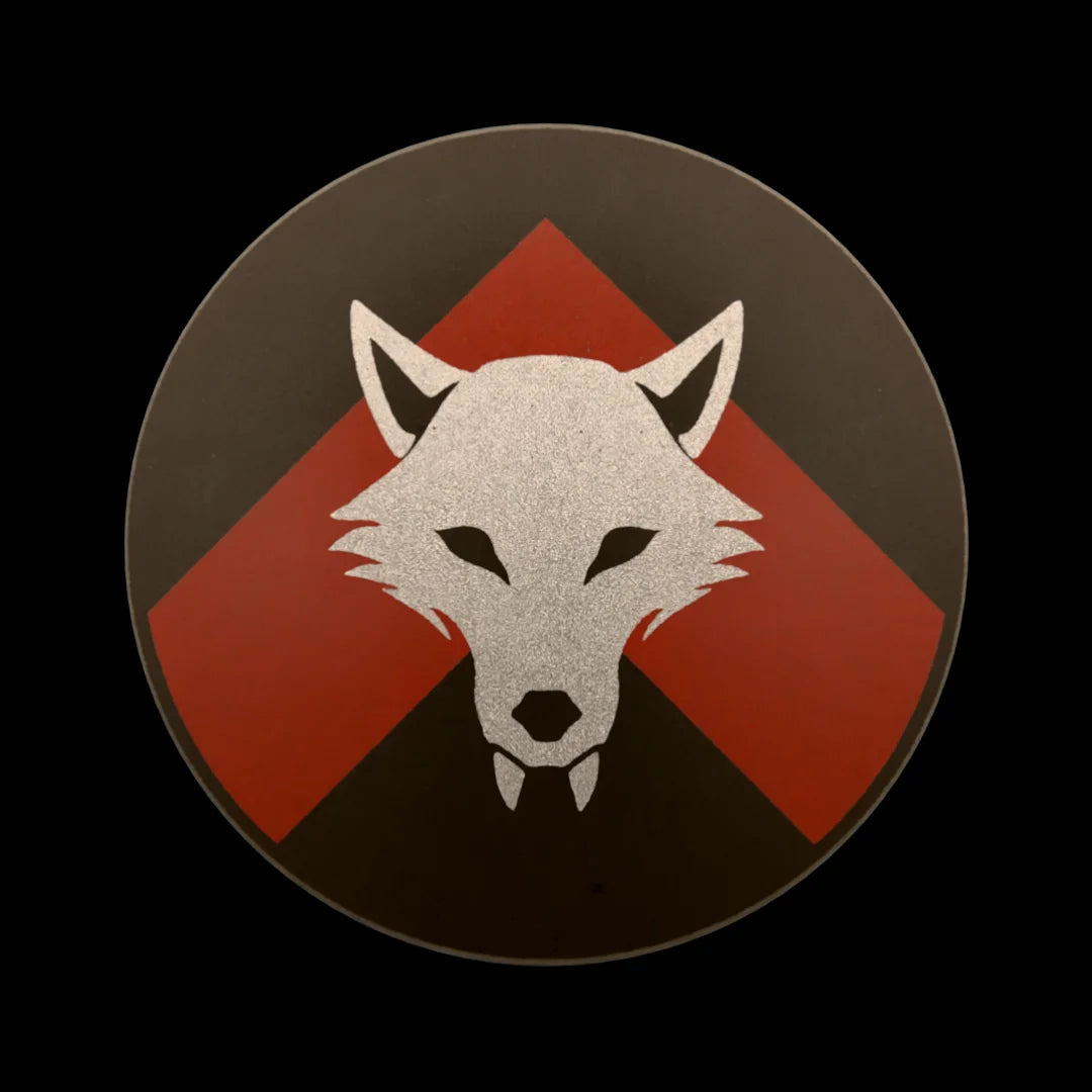Castle Clad Bricks Dark Bluish Grey round shield with Metallic Silver wolf head on Dark Red chevron on black backing. Pristine edition.