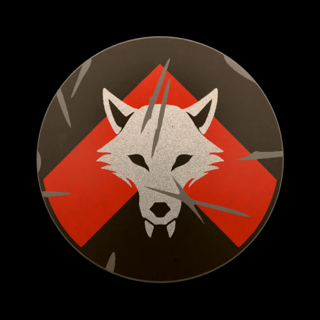 Castle Clad Bricks Dark Bluish Grey round shield with Metallic Silver wolf head on Red chevron on black backing. Heavy damage edition.