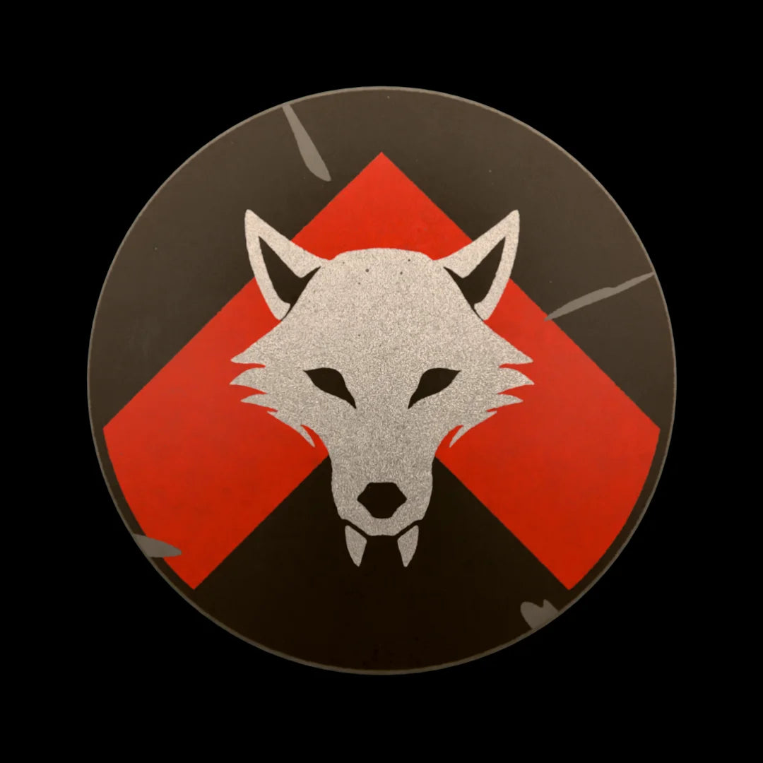 Castle Clad Bricks Dark Bluish Grey round shield with Metallic Silver wolf head on Red chevron on black backing. Light damage edition.